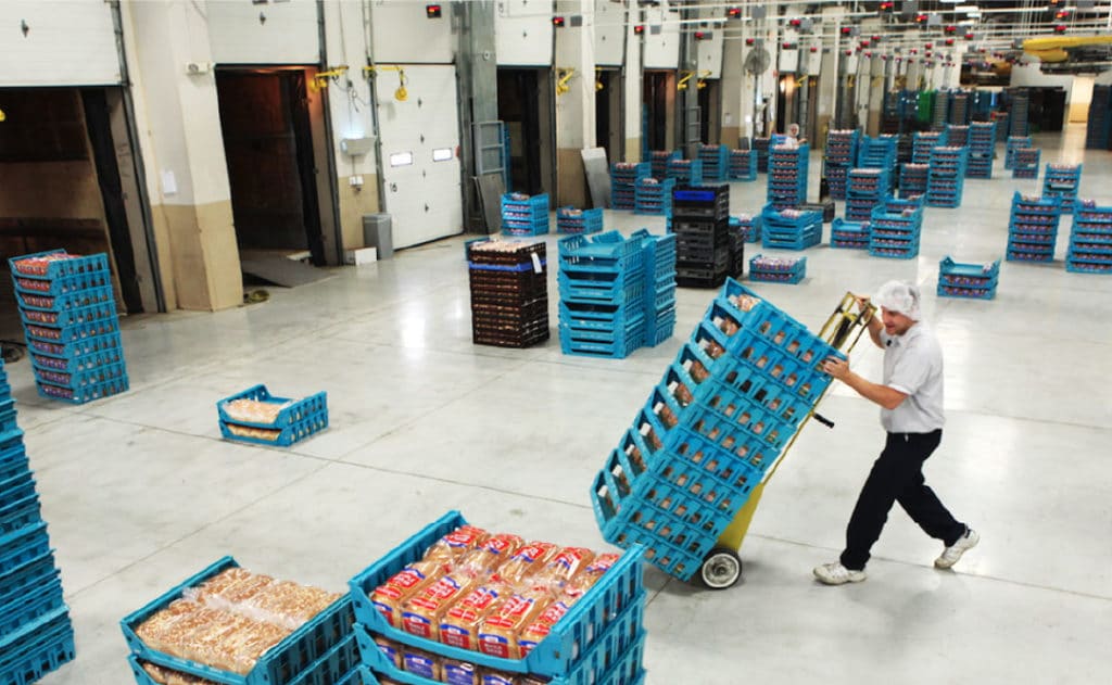 Shipping professional wheels pallets containing loaves of bread at the Pan-O-Gold Baking Company in St. Cloud, MN, the production site for Country Hearth Bread.